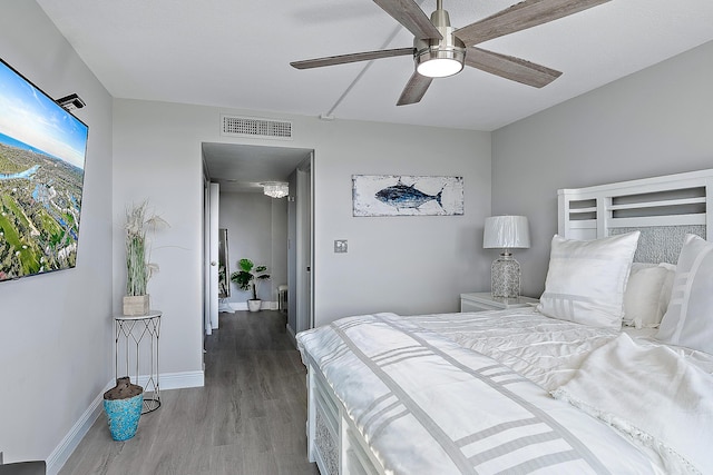 bedroom featuring hardwood / wood-style floors and ceiling fan