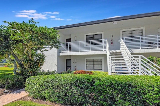 view of front of property with a balcony