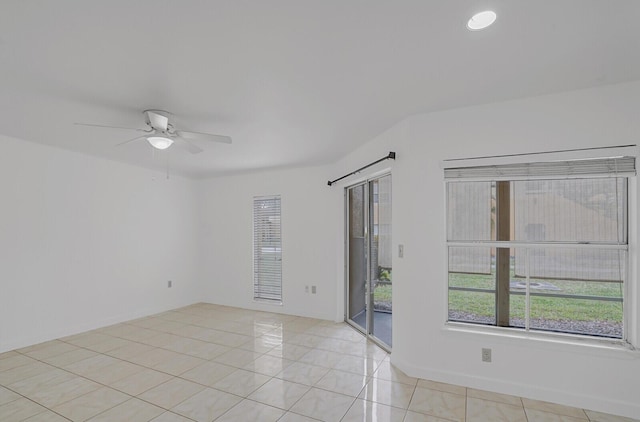 unfurnished room with ceiling fan and light tile patterned floors