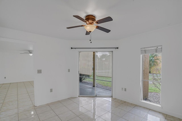 unfurnished room featuring light tile patterned flooring and ceiling fan