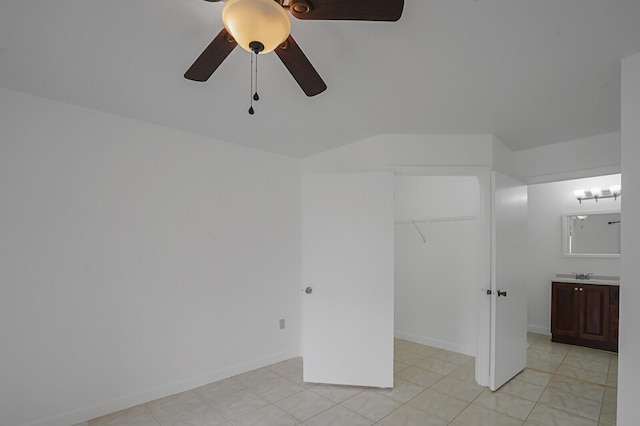 interior space with sink and ceiling fan