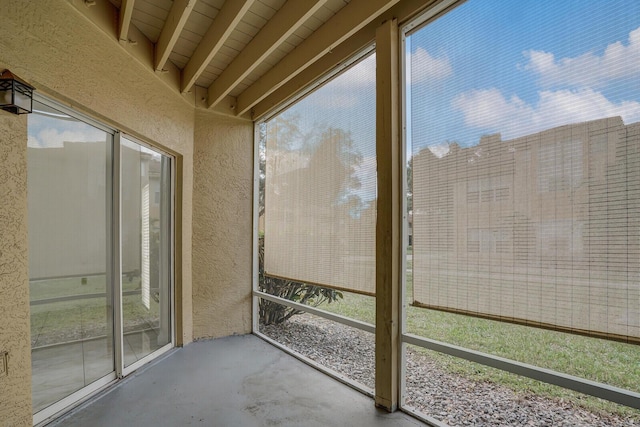 unfurnished sunroom featuring a wealth of natural light