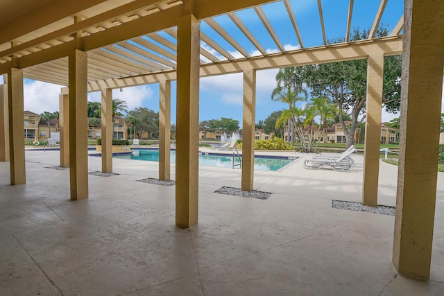 view of swimming pool featuring a pergola and a patio area