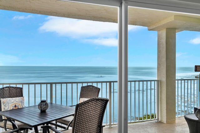 balcony featuring a water view