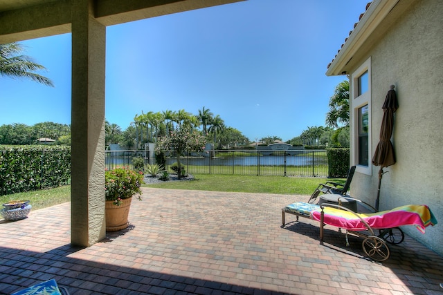 view of patio featuring a water view