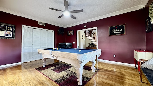 rec room with wood-type flooring, pool table, visible vents, a ceiling fan, and a textured ceiling