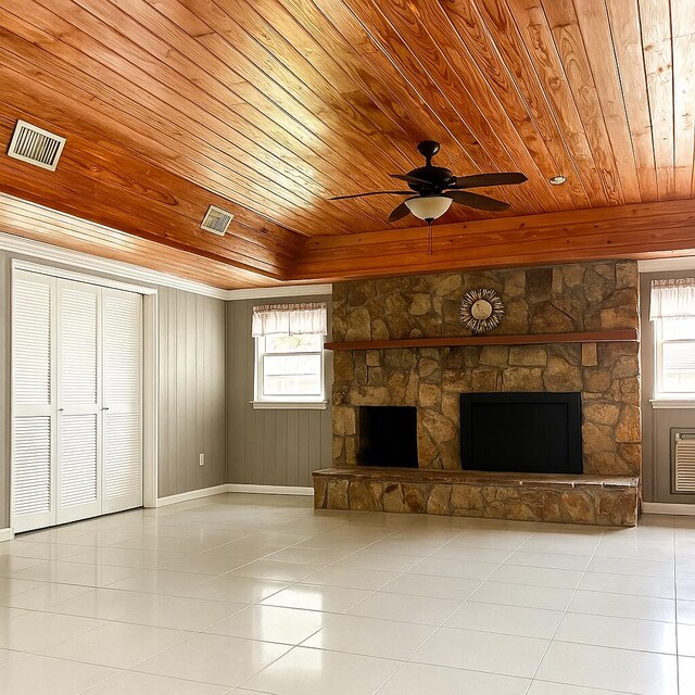 sunroom with vaulted ceiling with beams, plenty of natural light, and a ceiling fan