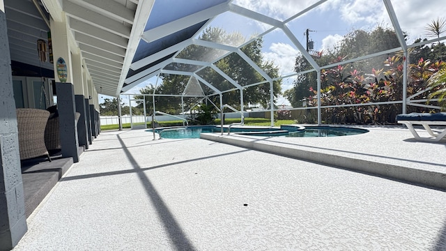 view of pool with a patio area, a lanai, and a fenced in pool