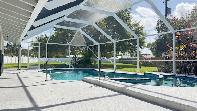 view of pool with a fenced in pool, glass enclosure, fence, a yard, and a patio area