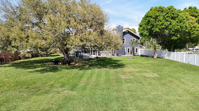 view of yard with a fenced backyard