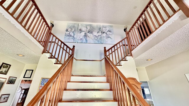 stairs featuring baseboards and wood finished floors