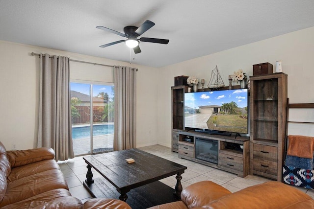 tiled living room with ceiling fan