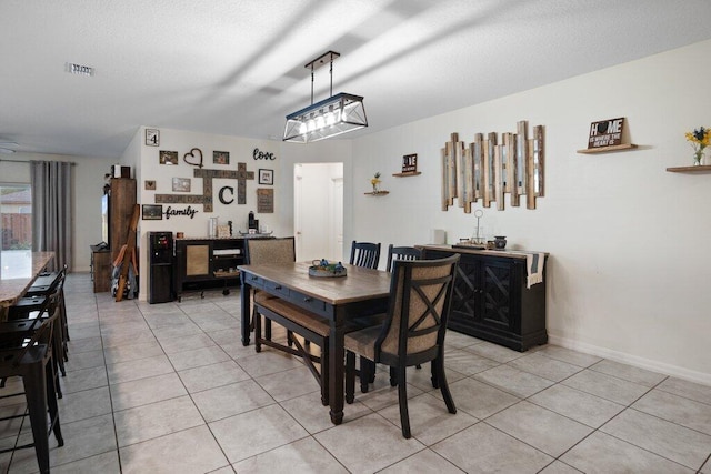 dining room with light tile patterned floors