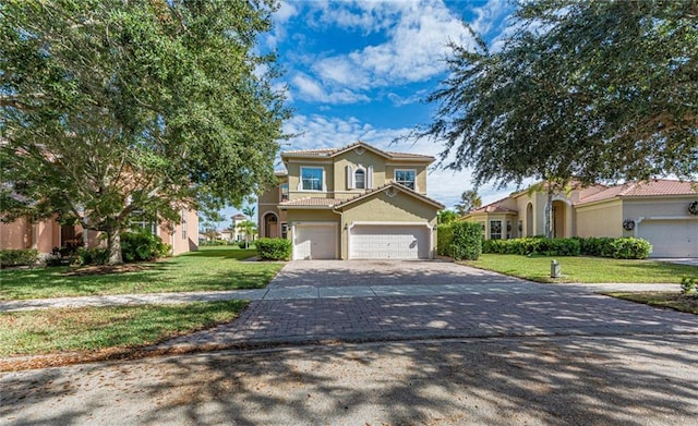 mediterranean / spanish home with a garage and a front lawn