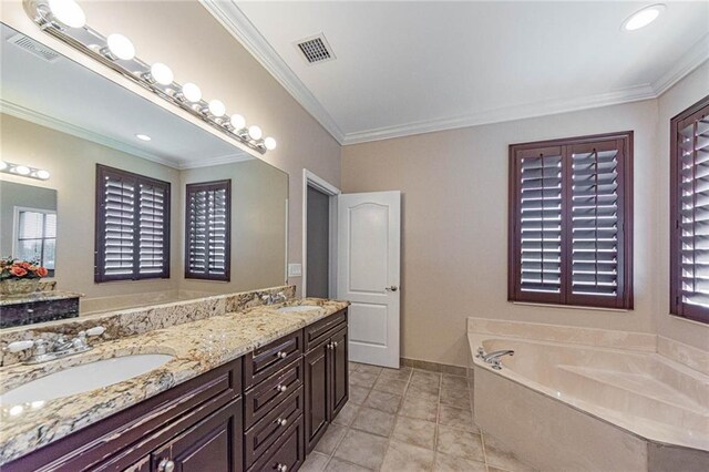 bathroom featuring vanity, a bath, tile patterned flooring, and ornamental molding