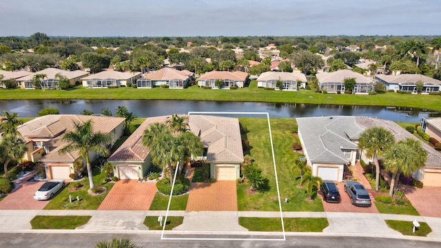 birds eye view of property with a water view