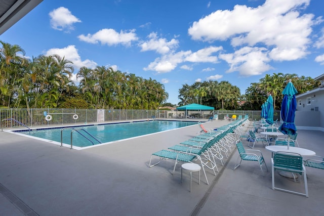 view of swimming pool with a patio area