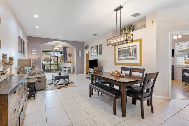 dining space with light tile patterned flooring and ceiling fan