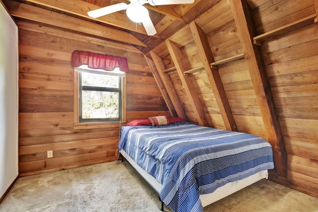 carpeted bedroom featuring lofted ceiling and wood walls