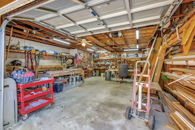 garage with a garage door opener and a workshop area