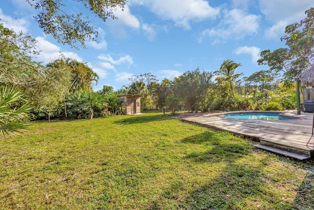 view of yard with a pool side deck