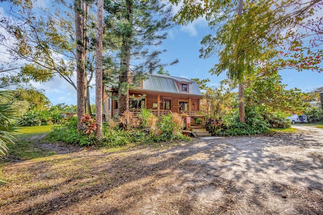 cabin featuring covered porch