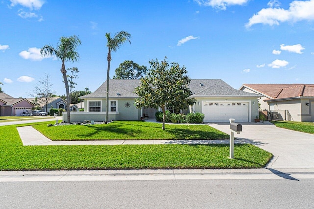 view of front of home with a garage and a front yard