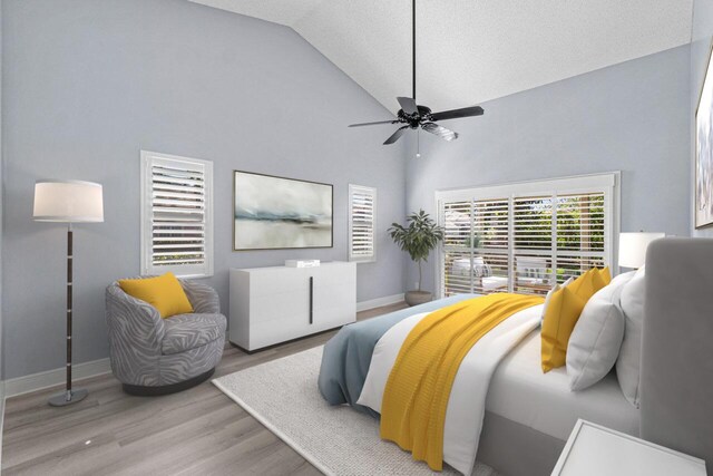 unfurnished room with high vaulted ceiling, ceiling fan, and light wood-type flooring