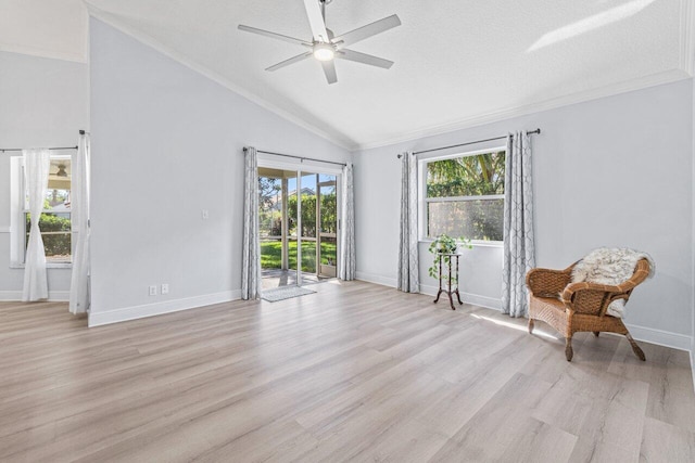 sitting room featuring lofted ceiling, crown molding, light hardwood / wood-style flooring, a textured ceiling, and ceiling fan