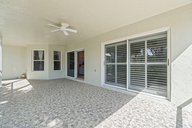 view of patio / terrace featuring ceiling fan