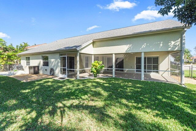 unfurnished sunroom with ceiling fan