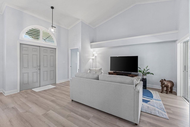 living room featuring ornamental molding, high vaulted ceiling, and light hardwood / wood-style floors