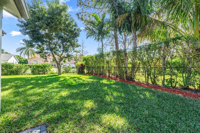 rear view of property with a yard and a patio