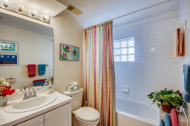 full bathroom with vanity, shower / bathtub combination with curtain, and toilet