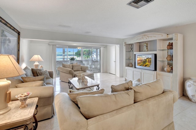 living room featuring a textured ceiling