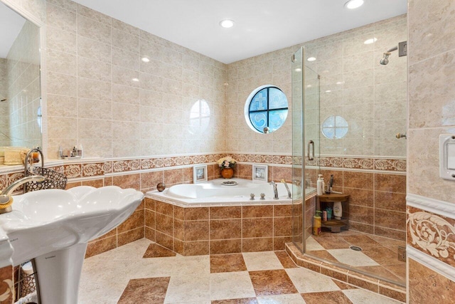 bathroom with plus walk in shower and tile walls