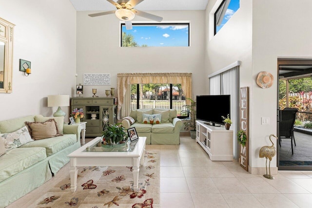 tiled living room with a wealth of natural light and ceiling fan