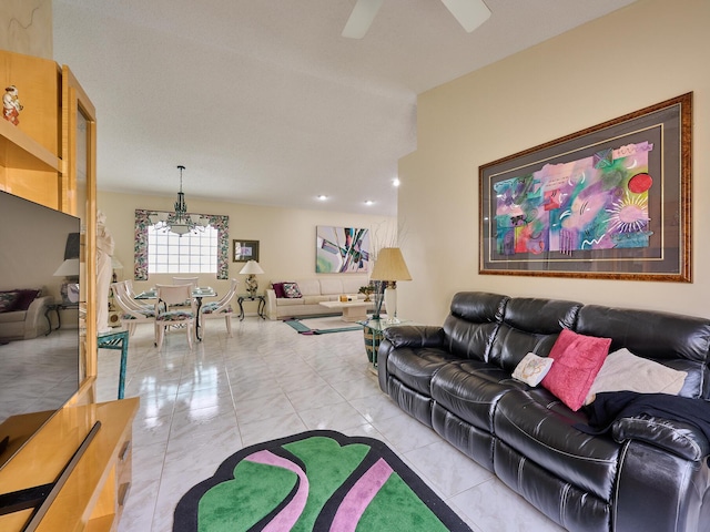 living room featuring light tile patterned flooring and ceiling fan