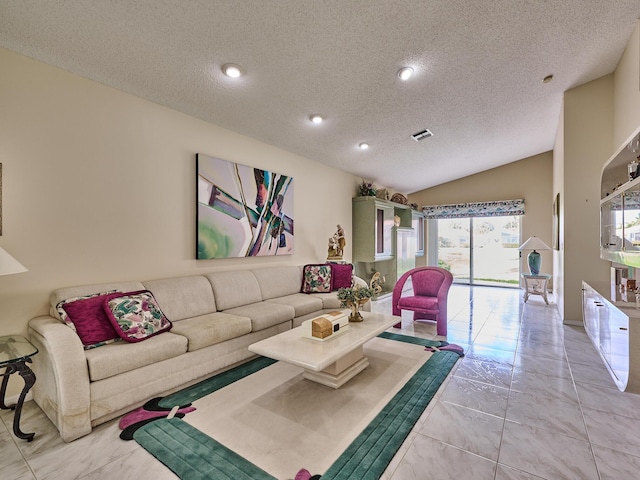 living room with vaulted ceiling and a textured ceiling