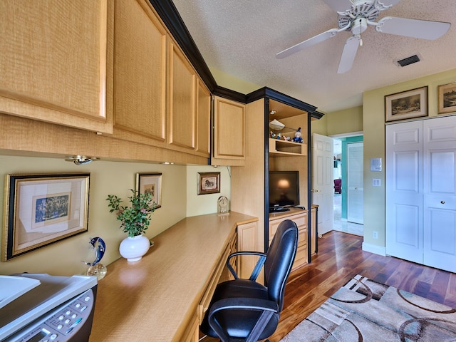 office space with ceiling fan, dark hardwood / wood-style floors, washer / dryer, and a textured ceiling