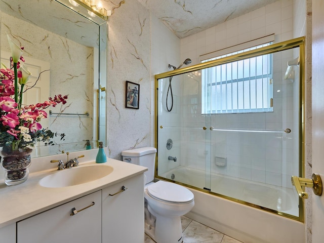 full bathroom featuring vanity, toilet, and combined bath / shower with glass door