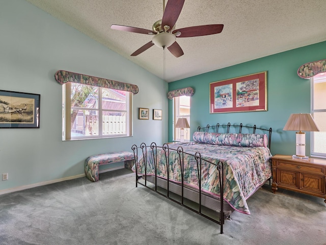 carpeted bedroom featuring lofted ceiling, ceiling fan, and a textured ceiling