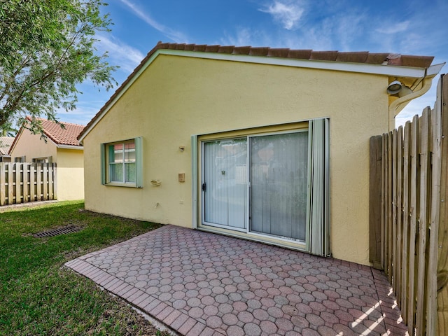 rear view of house featuring a patio area