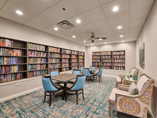 interior space featuring ceiling fan and carpet flooring