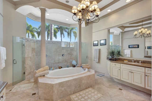 bathroom with shower with separate bathtub, decorative columns, ornamental molding, vanity, and an inviting chandelier