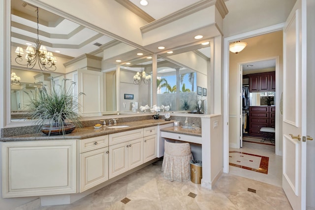 bathroom with ornamental molding, tile patterned flooring, vanity, and a notable chandelier