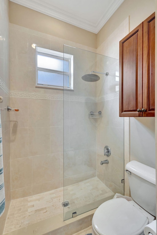 bathroom featuring walk in shower, ornamental molding, and toilet