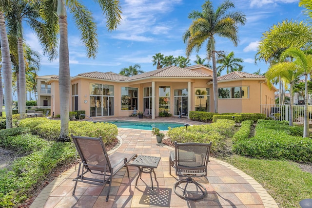 back of house featuring a patio area