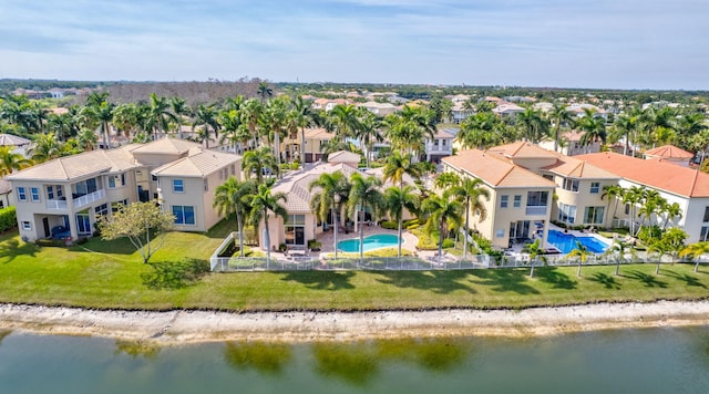 birds eye view of property with a water view