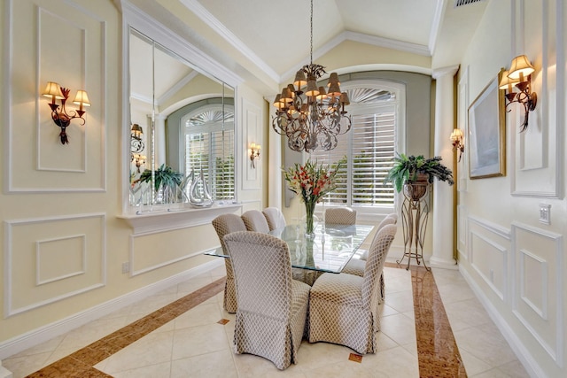 dining room featuring ornamental molding, vaulted ceiling, light tile patterned floors, and an inviting chandelier